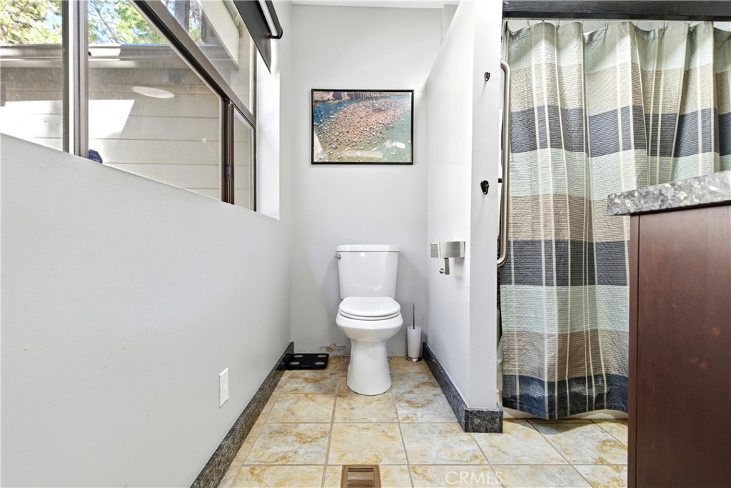 5652 Sycamore Street Wrightwood, CA 92397 - Photo 18 of 50 a bathroom with a toilet and a shower