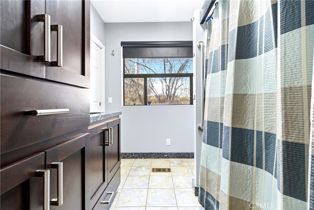 5652 Sycamore Street Wrightwood, CA 92397 - Photo 21 of 50 a view of a bathroom with a glass door