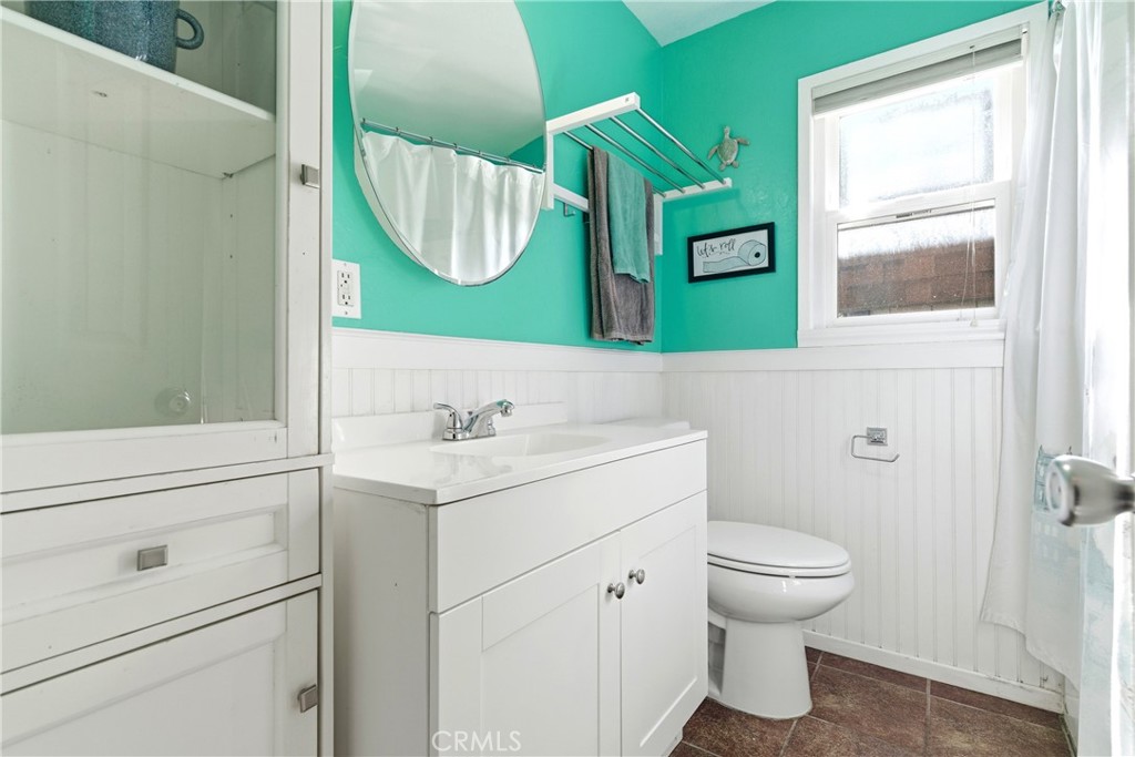 5652 Sycamore Street Wrightwood, CA 92397 - Photo 27 of 50 a bathroom with a toilet sink and mirror