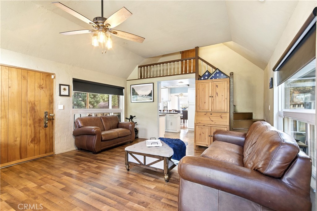 5652 Sycamore Street Wrightwood, CA 92397 - Photo 38 of 50 a living room with furniture a large window and a chandelier