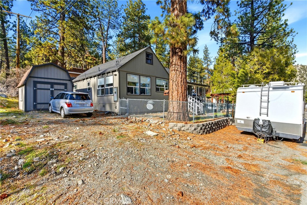 5652 Sycamore Street Wrightwood, CA 92397 - Photo 44 of 50 a front view of a house with a yard covered in snow