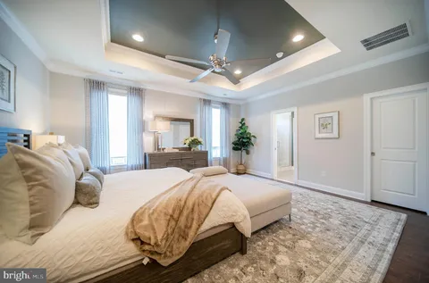 a large white bed in a white room