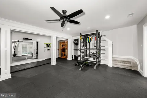 a bedroom with two beds and a chandelier