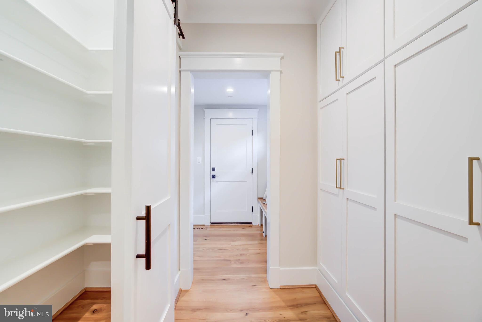 7818 Glenbrook Road Bethesda, MD 20814 - Photo 20 of 95 a view of a hallway with wooden floor and staircase