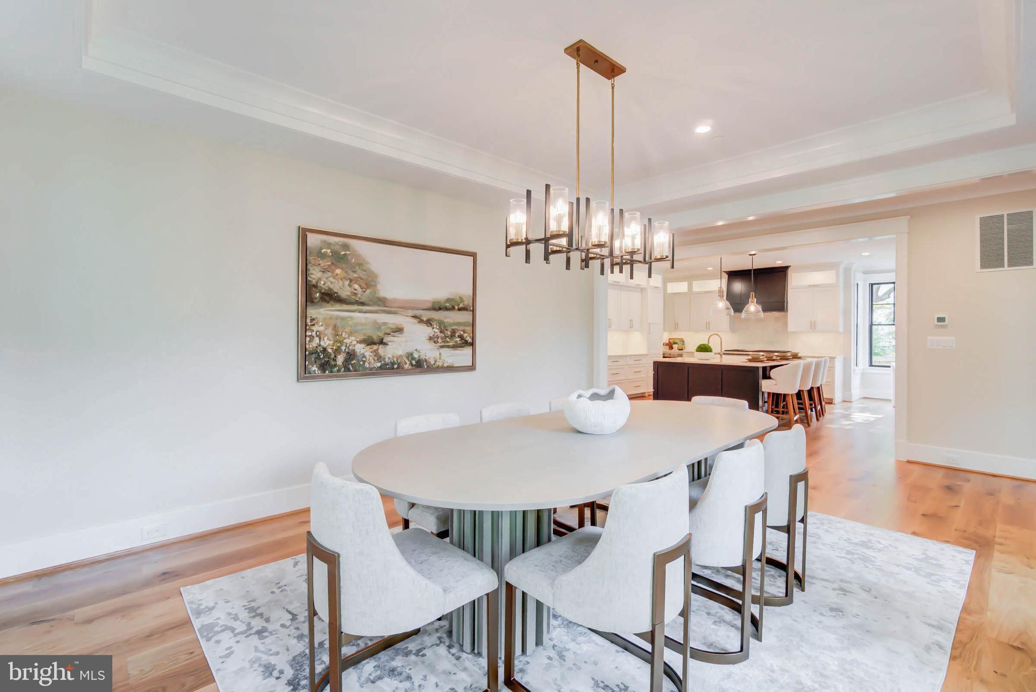 7818 Glenbrook Road Bethesda, MD 20814 - Photo 29 of 95 a view of a dining room with furniture and wooden floor