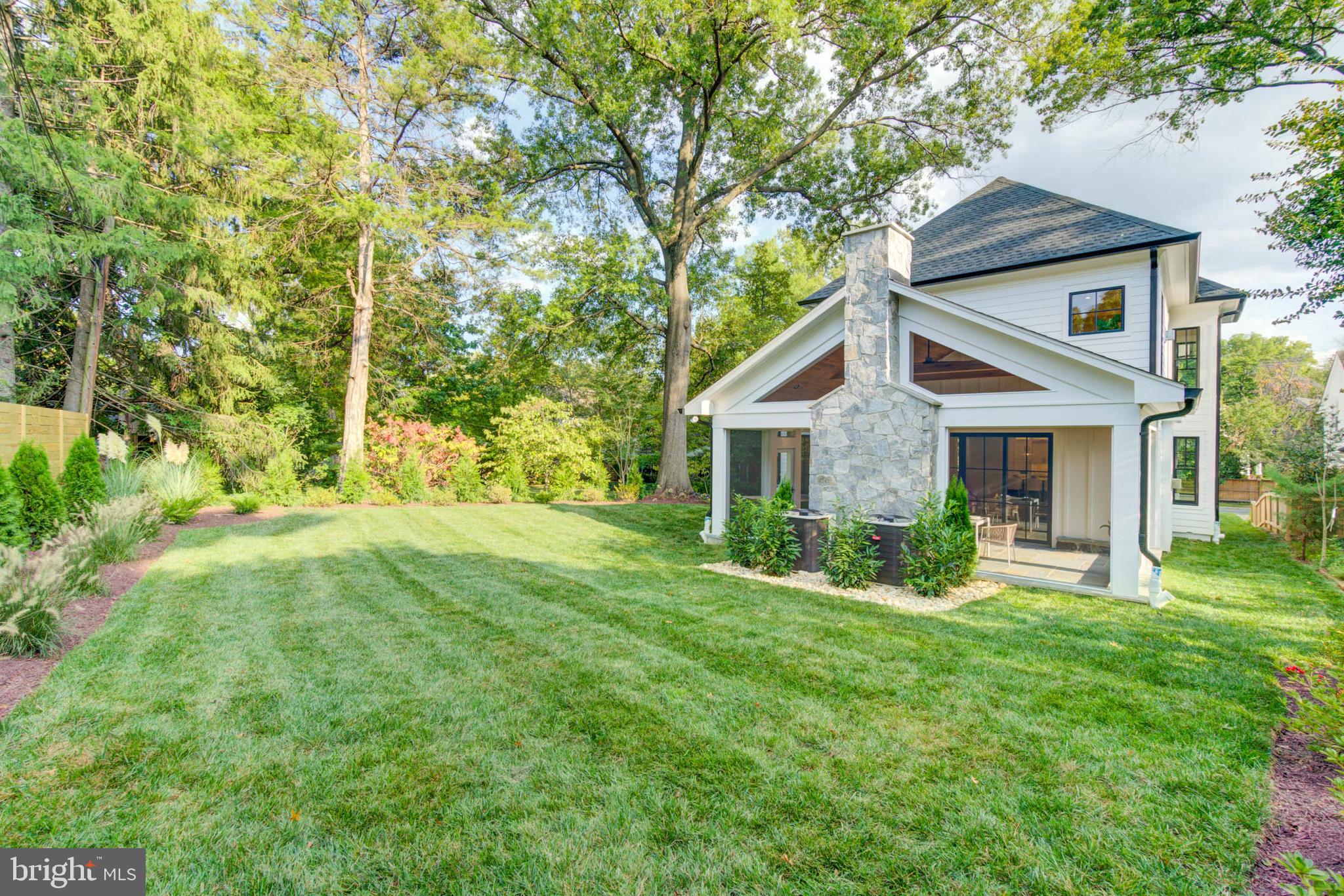 7818 Glenbrook Road Bethesda, MD 20814 - Photo 46 of 95 a front view of house with yard and green space