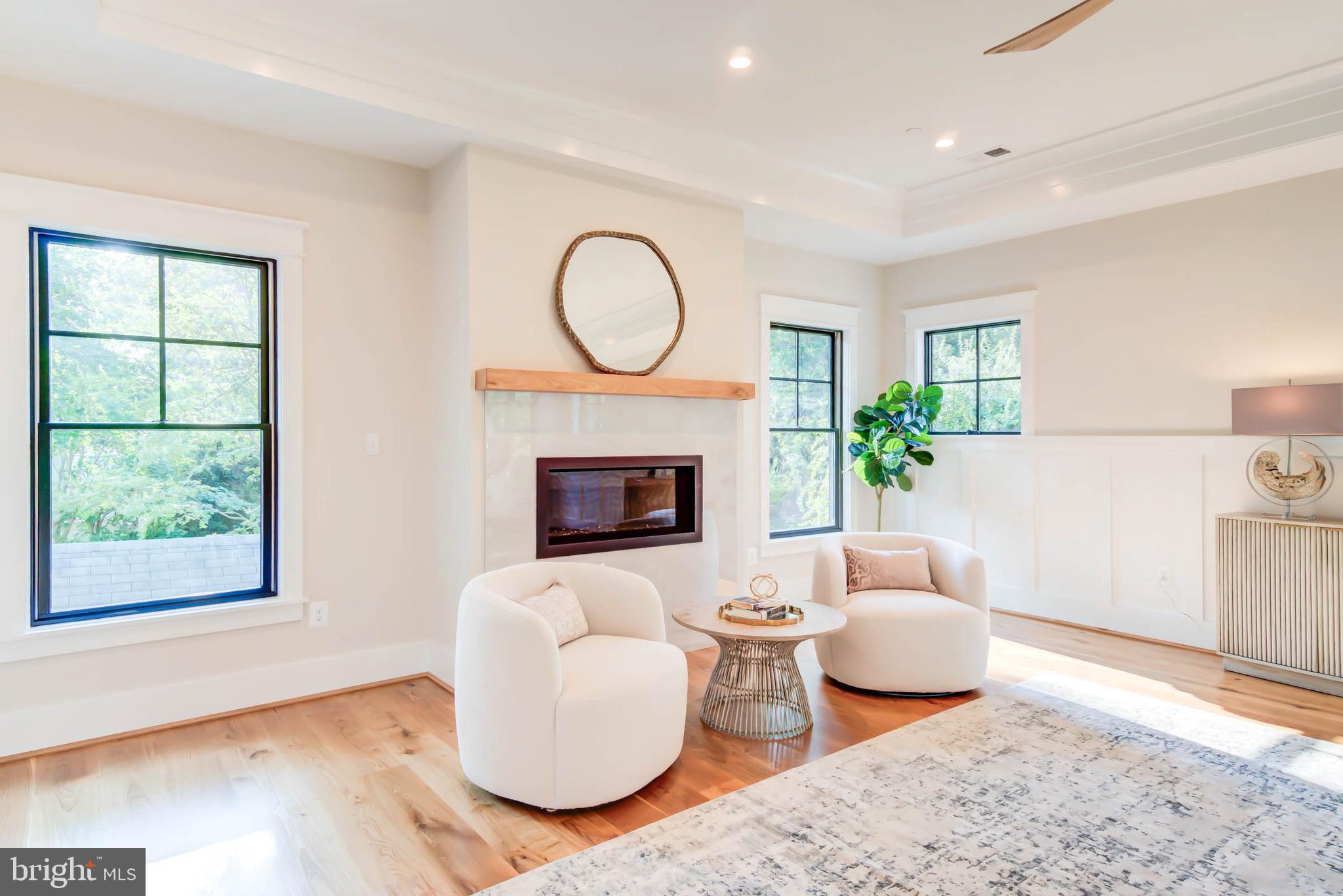 7818 Glenbrook Road Bethesda, MD 20814 - Photo 56 of 95 a living room with furniture a window and a fireplace