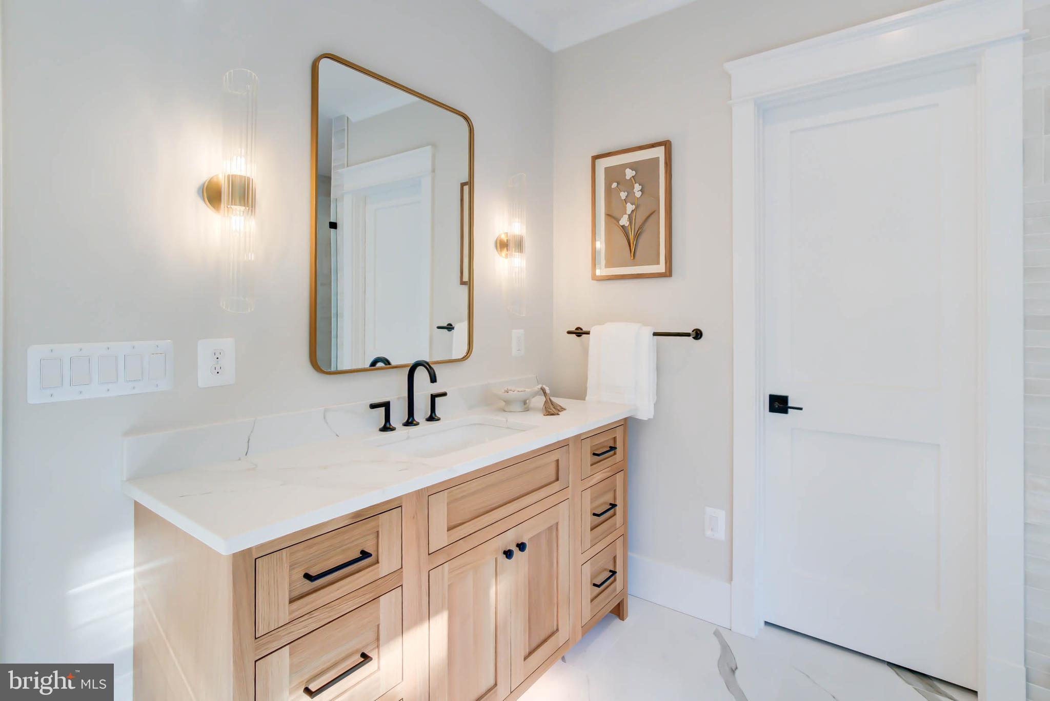 7818 Glenbrook Road Bethesda, MD 20814 - Photo 67 of 95 a bathroom with a sink and a mirror