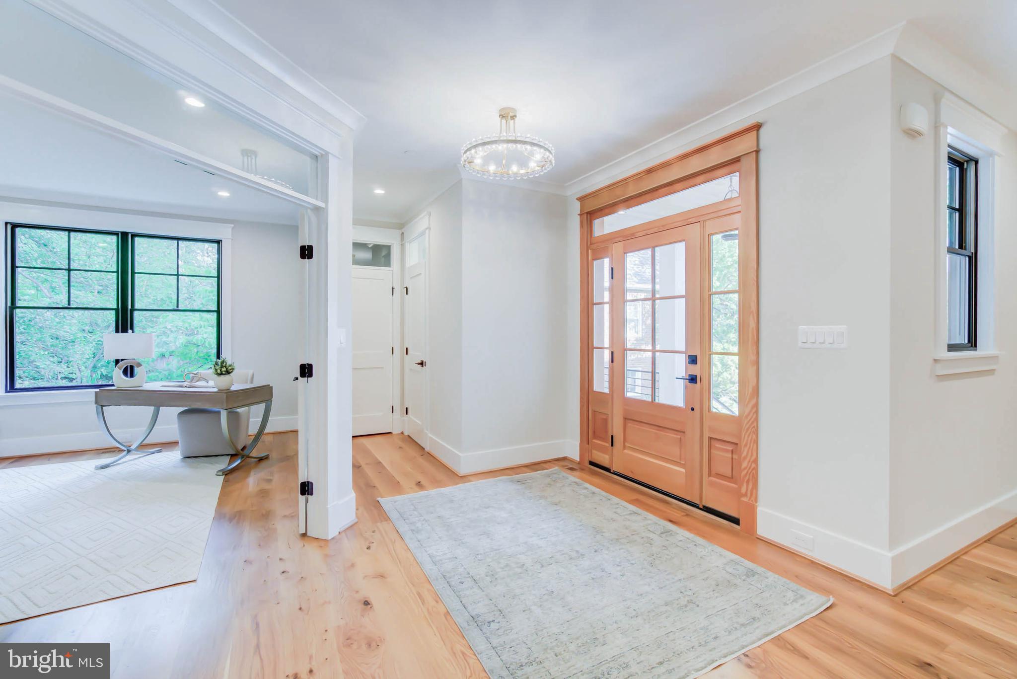7818 Glenbrook Road Bethesda, MD 20814 - Photo 7 of 95 a living room with furniture and a large window