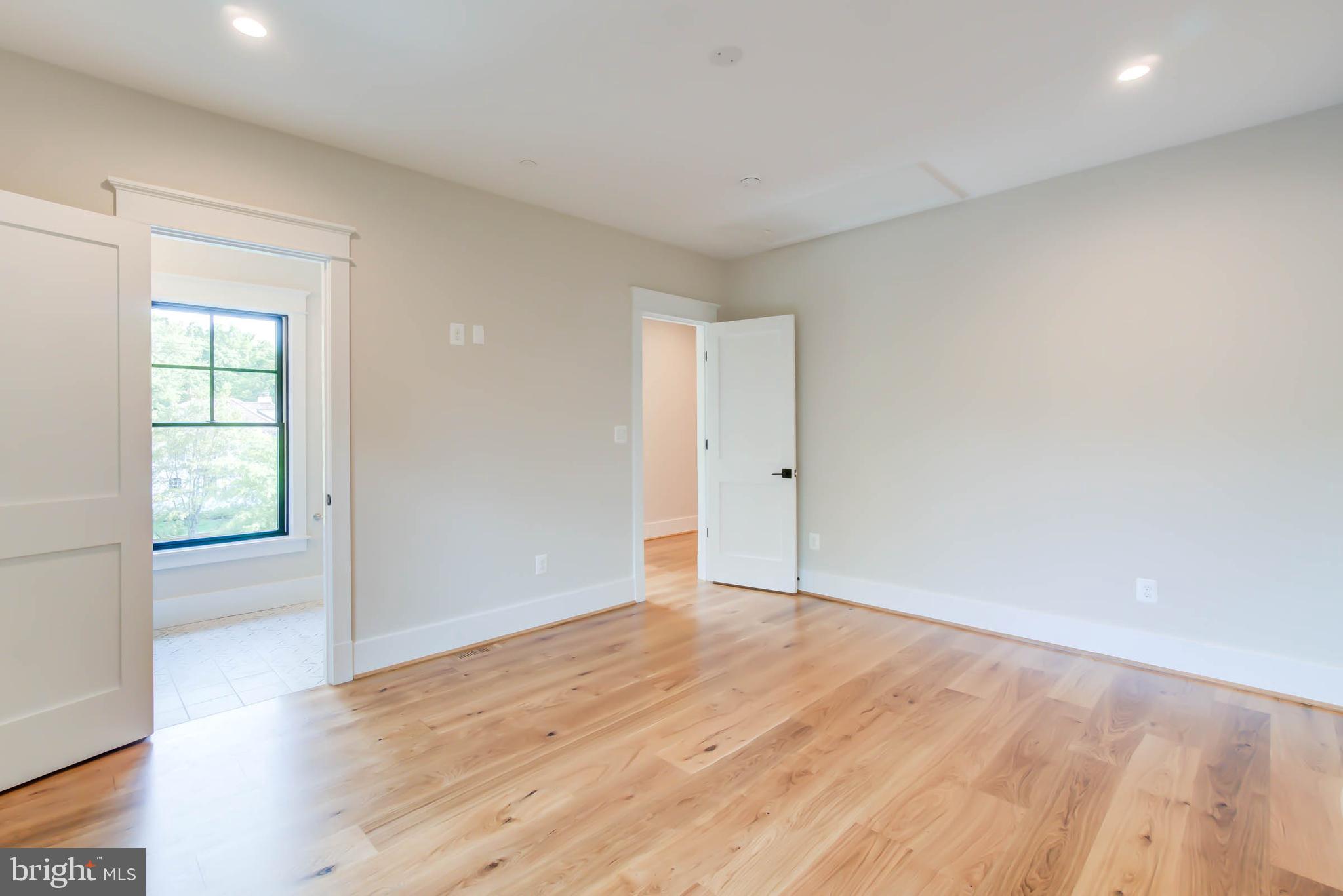 7818 Glenbrook Road Bethesda, MD 20814 - Photo 73 of 95 an empty room with wooden floor and windows