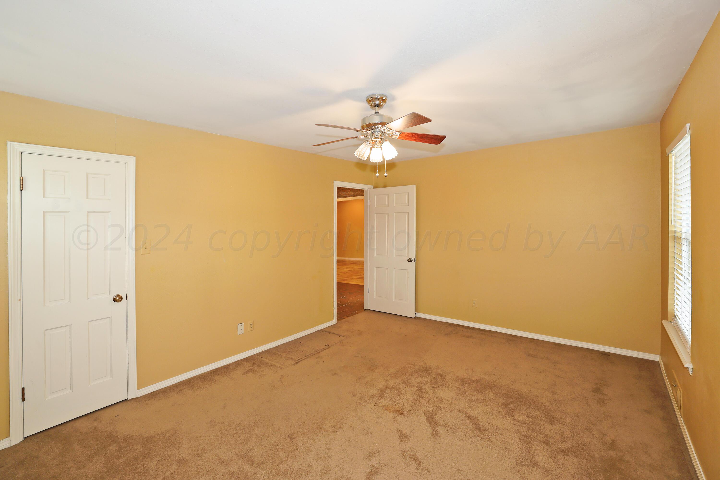 6709 Gainsborough Road Amarillo, TX 79106 - Photo 28 of 33 a view of an empty room with a window