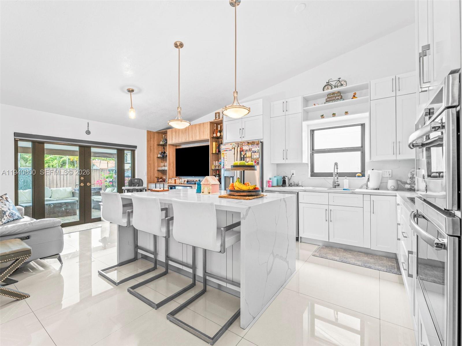 15805 Southwest 79th Terrace Miami, FL 33193 - Photo 11 of 50 a open kitchen with white cabinets and white appliances