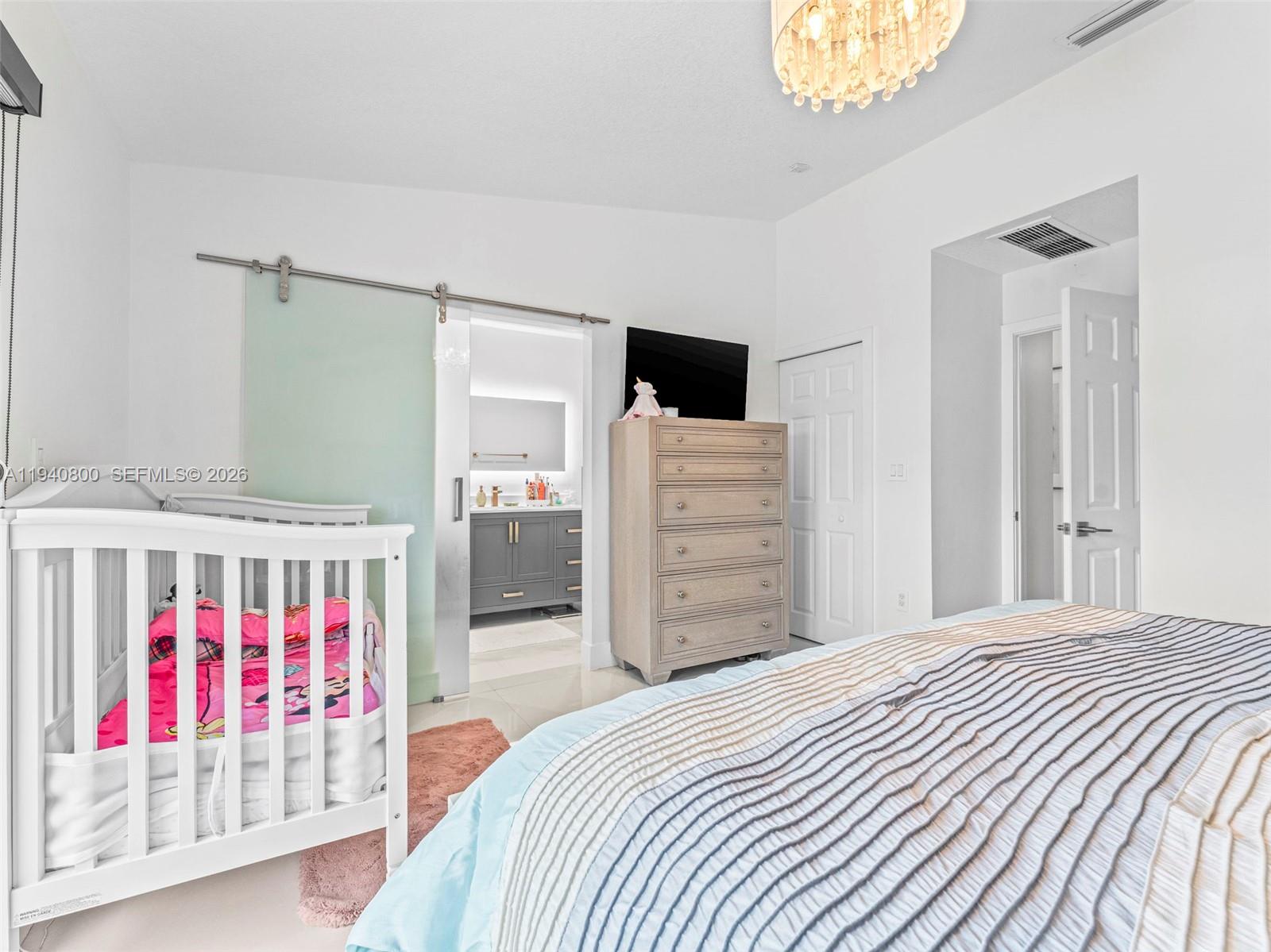 15805 Southwest 79th Terrace Miami, FL 33193 - Photo 20 of 50 a bedroom with a bed and dresser