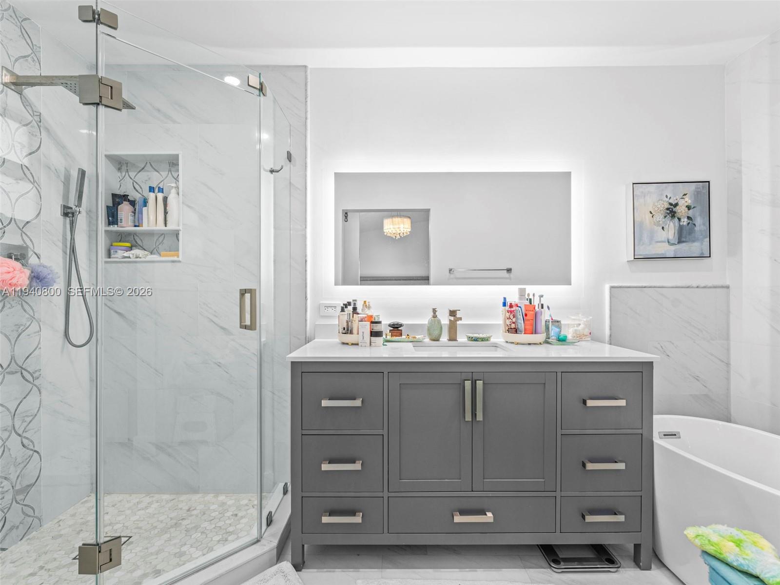 15805 Southwest 79th Terrace Miami, FL 33193 - Photo 21 of 50 a bathroom with a granite countertop sink a toilet and a shower