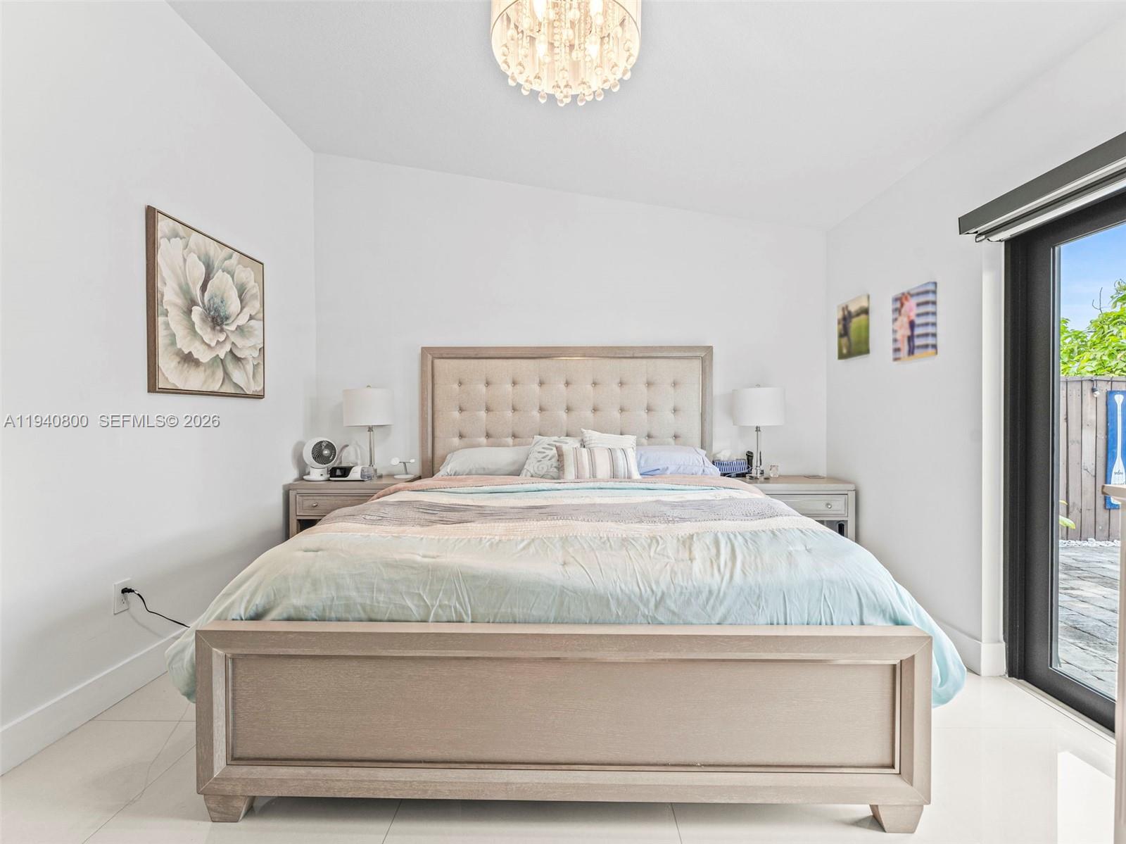 15805 Southwest 79th Terrace Miami, FL 33193 - Photo 23 of 50 a bedroom with a bed and a window