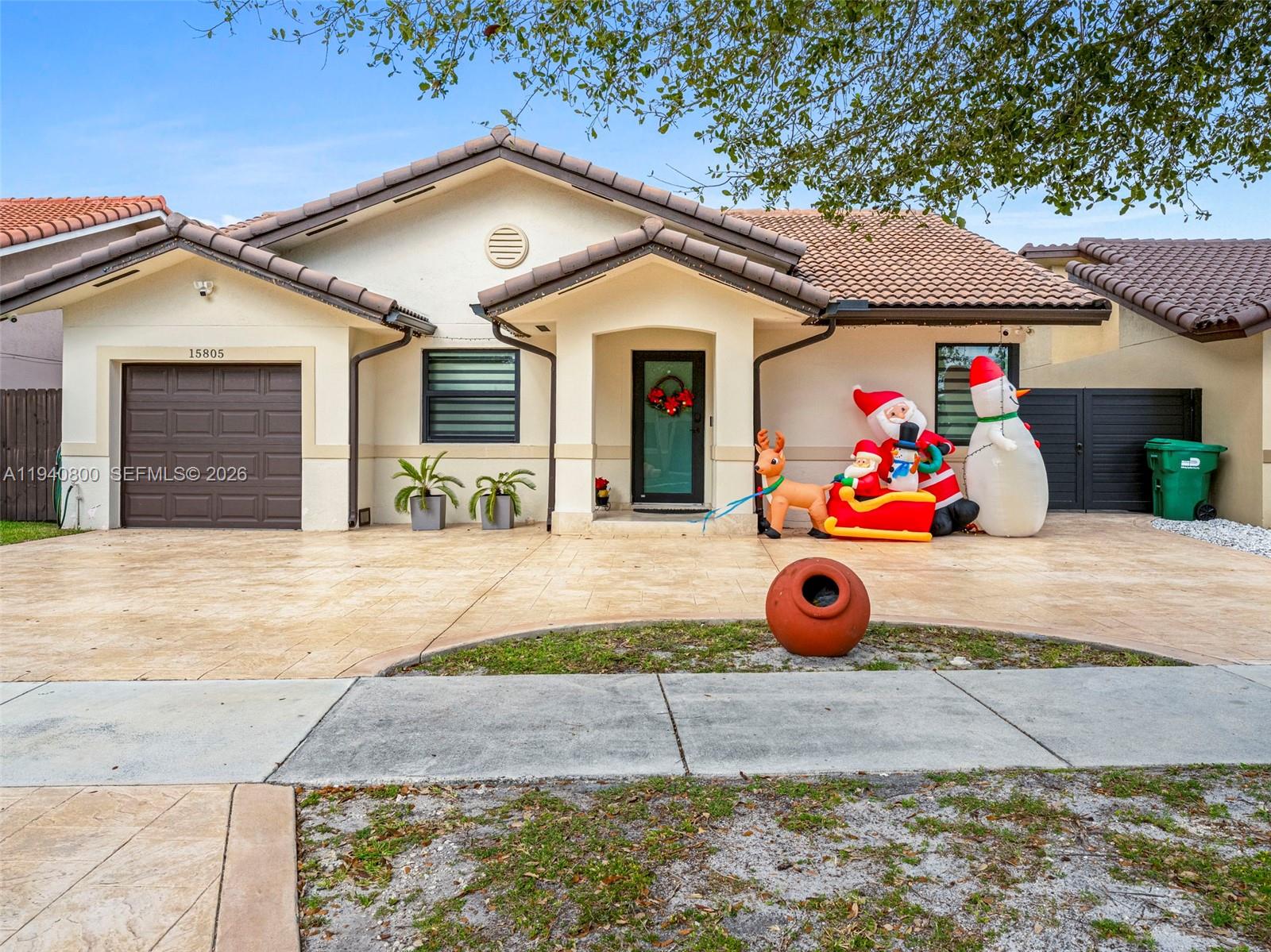 15805 Southwest 79th Terrace Miami, FL 33193 - Photo 3 of 50 a front view of house with outdoor space