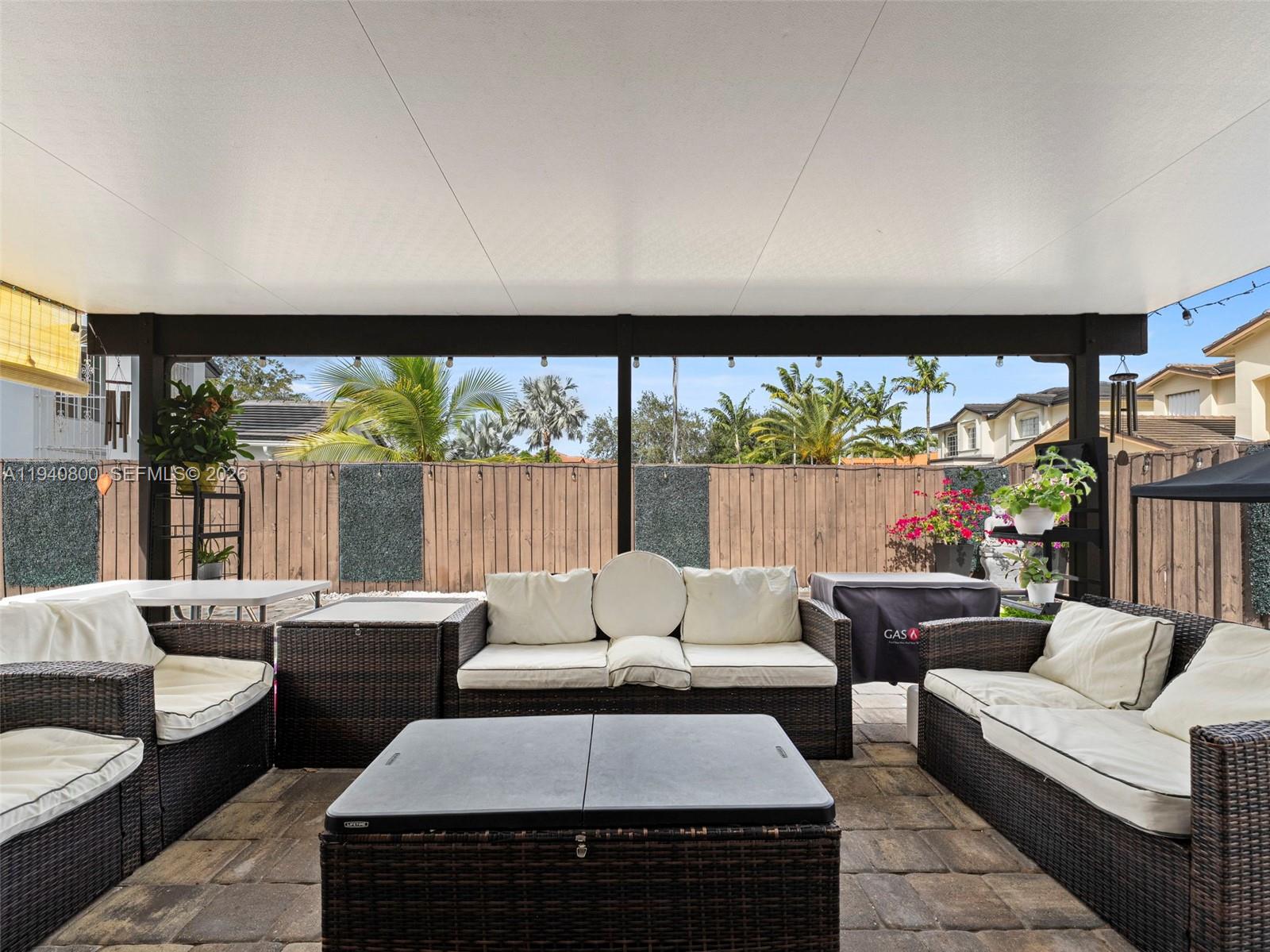 15805 Southwest 79th Terrace Miami, FL 33193 - Photo 33 of 50 a living room with furniture and a large window
