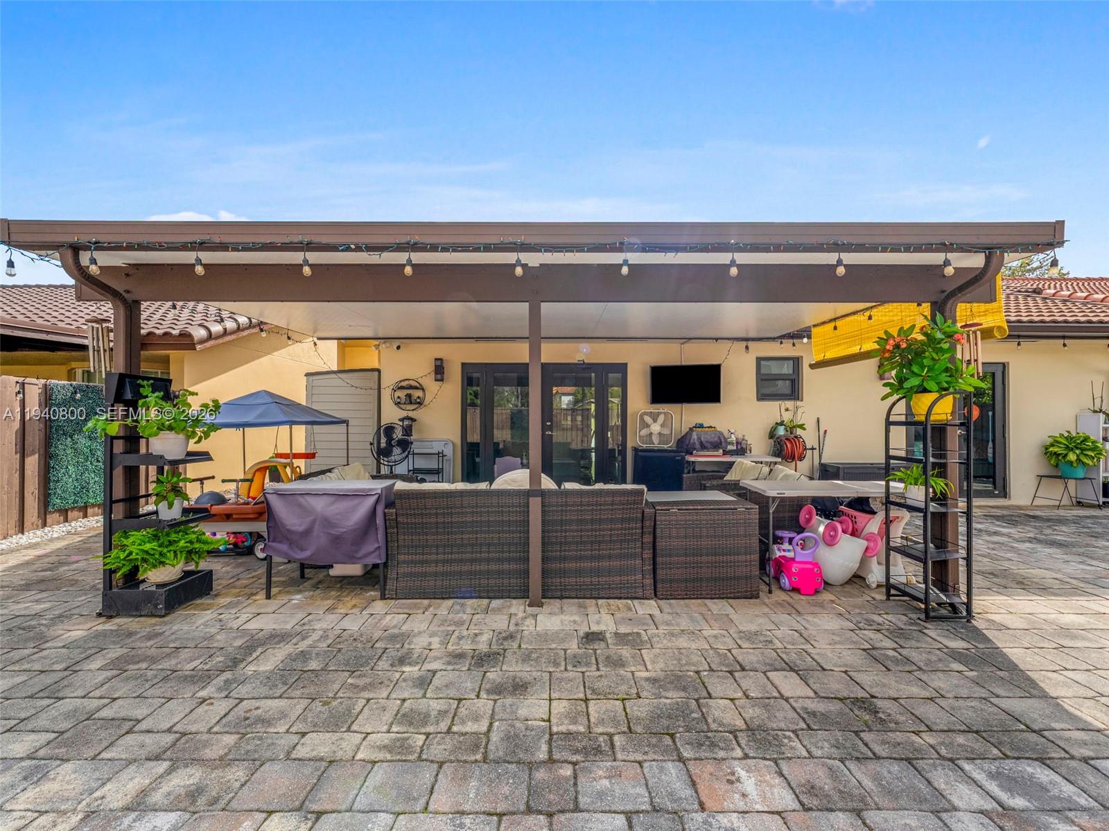 15805 Southwest 79th Terrace Miami, FL 33193 - Photo 36 of 50 a living room with furniture and a potted plant