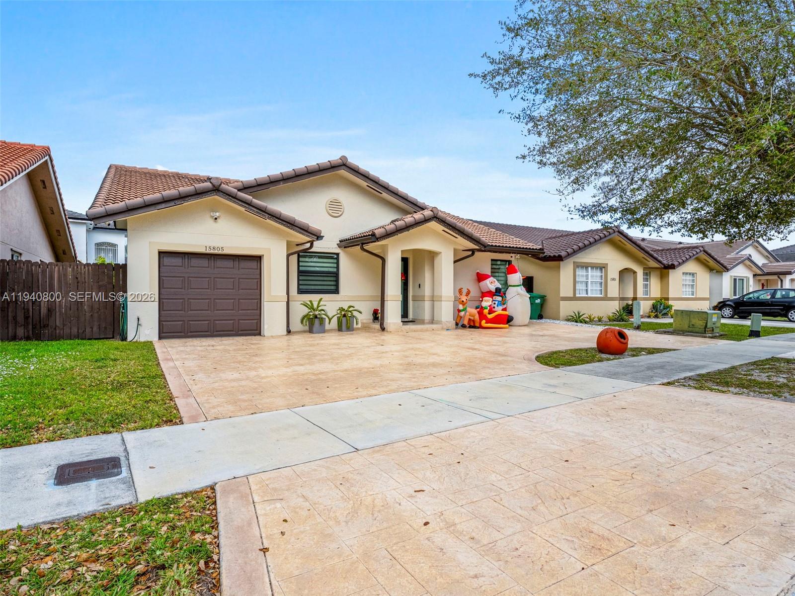 15805 Southwest 79th Terrace Miami, FL 33193 - Photo 42 of 50 a view of house with outdoor space and parking