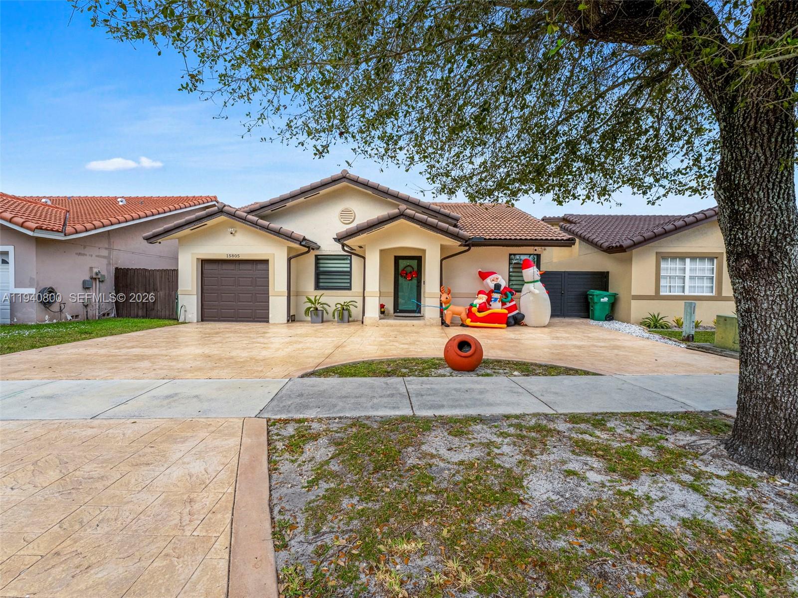 15805 Southwest 79th Terrace Miami, FL 33193 - Photo 43 of 50 a front view of a house with a yard