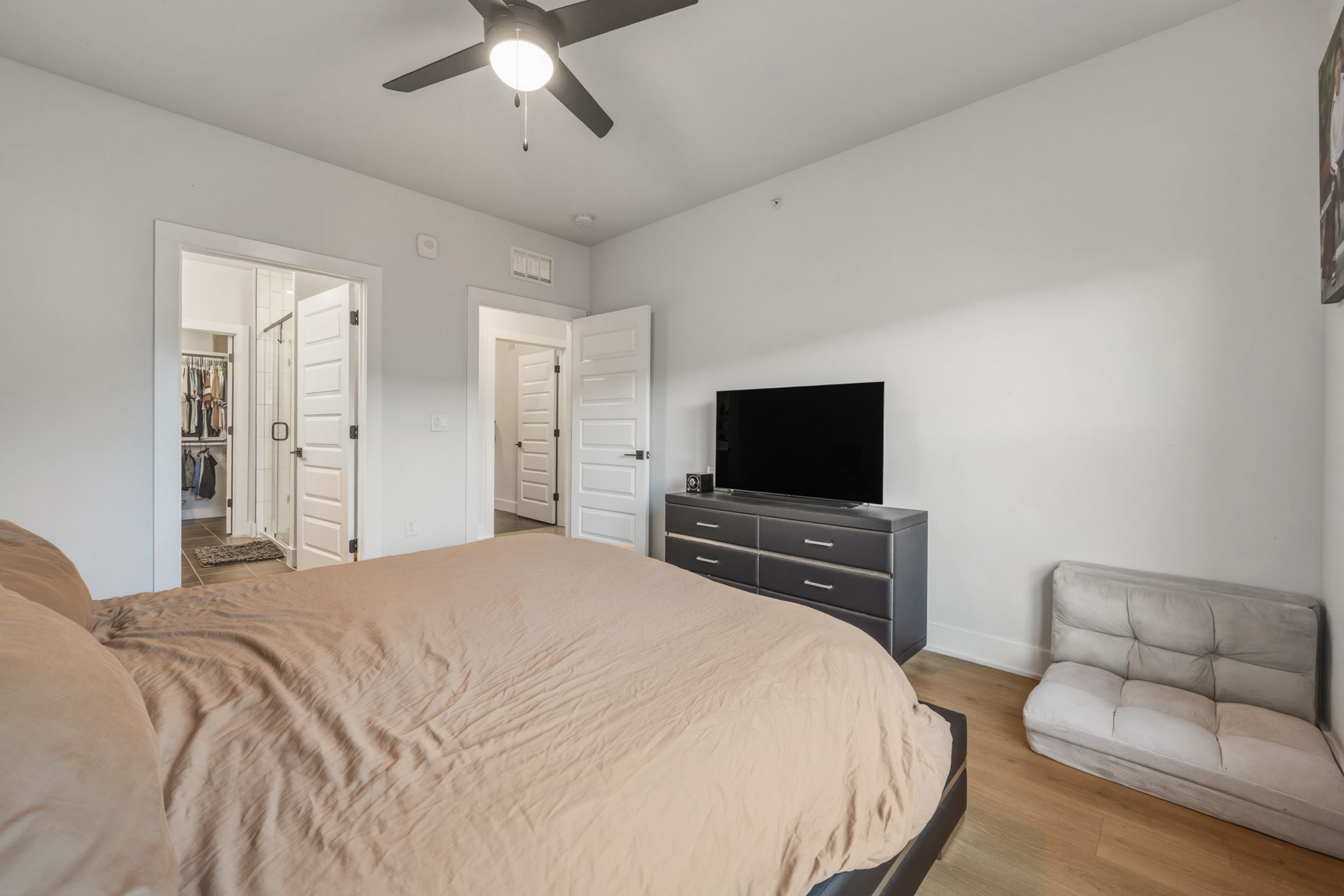 2500 Longview Street, Unit 300 Austin, TX 78705 - Photo 11 of 36 a bedroom with a bed and a flat screen tv