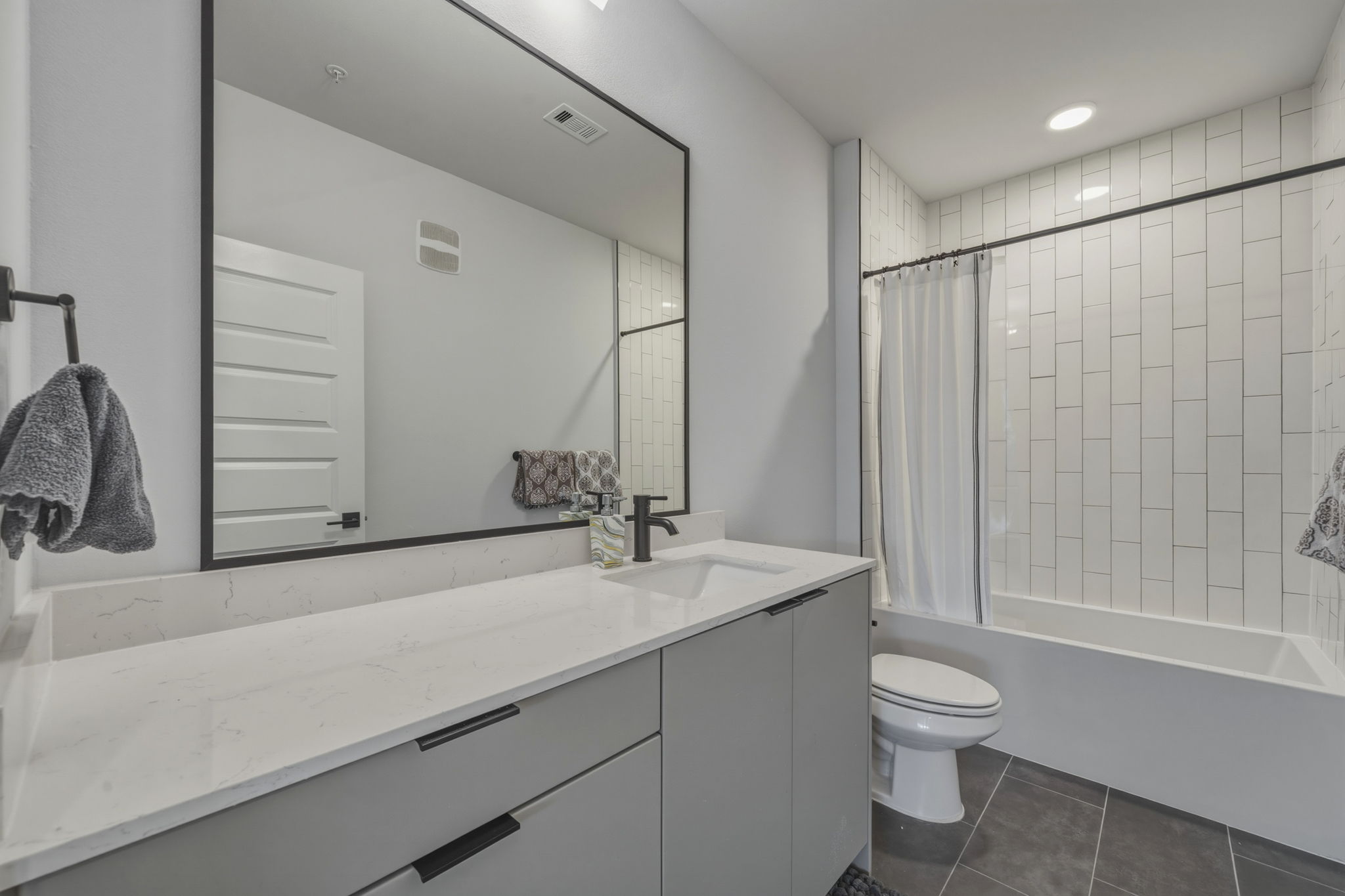 2500 Longview Street, Unit 300 Austin, TX 78705 - Photo 18 of 36 a bathroom with a sink a toilet and shower
