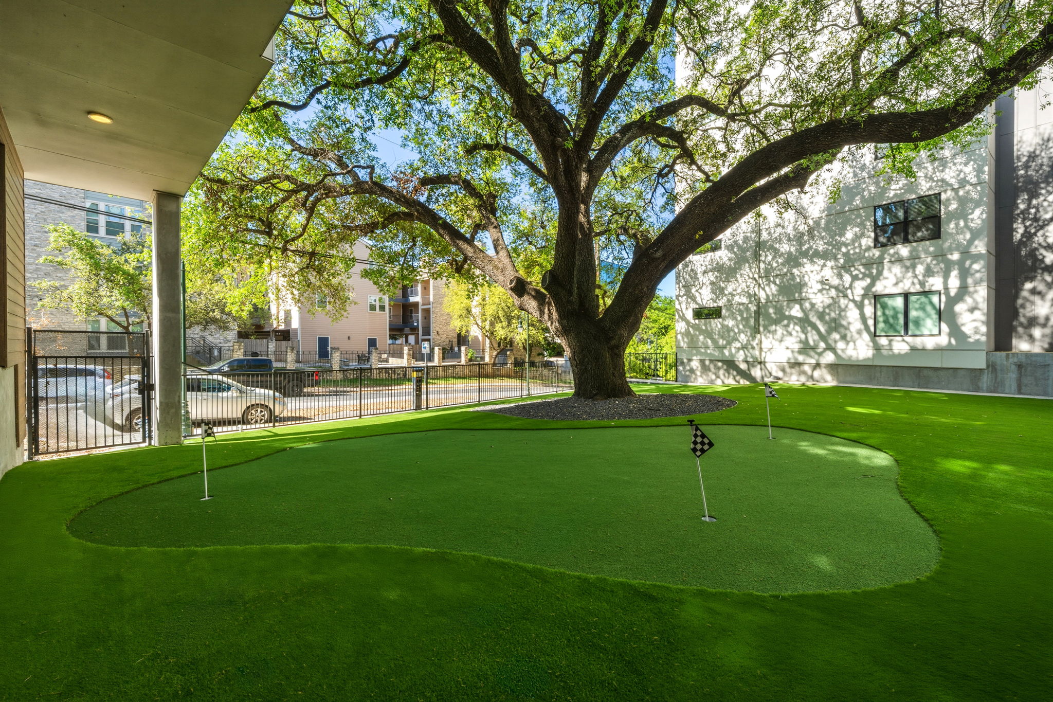 2500 Longview Street, Unit 300 Austin, TX 78705 - Photo 31 of 36 a backyard of a house with lots of green space and fountain