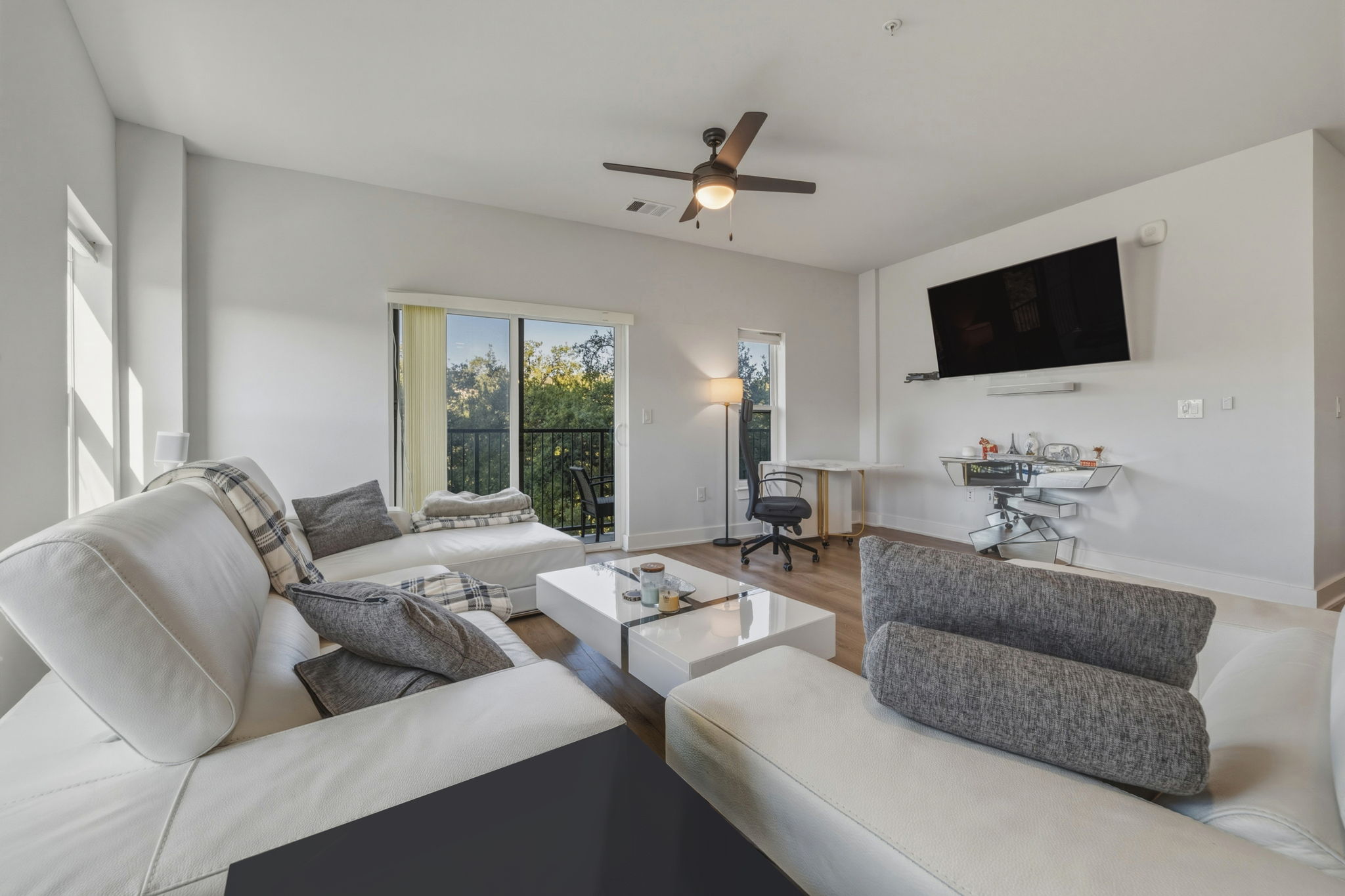 2500 Longview Street, Unit 300 Austin, TX 78705 - Photo 7 of 36 a living room with furniture and a flat screen tv