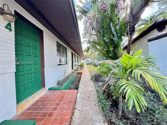 a view of a backyard with plants