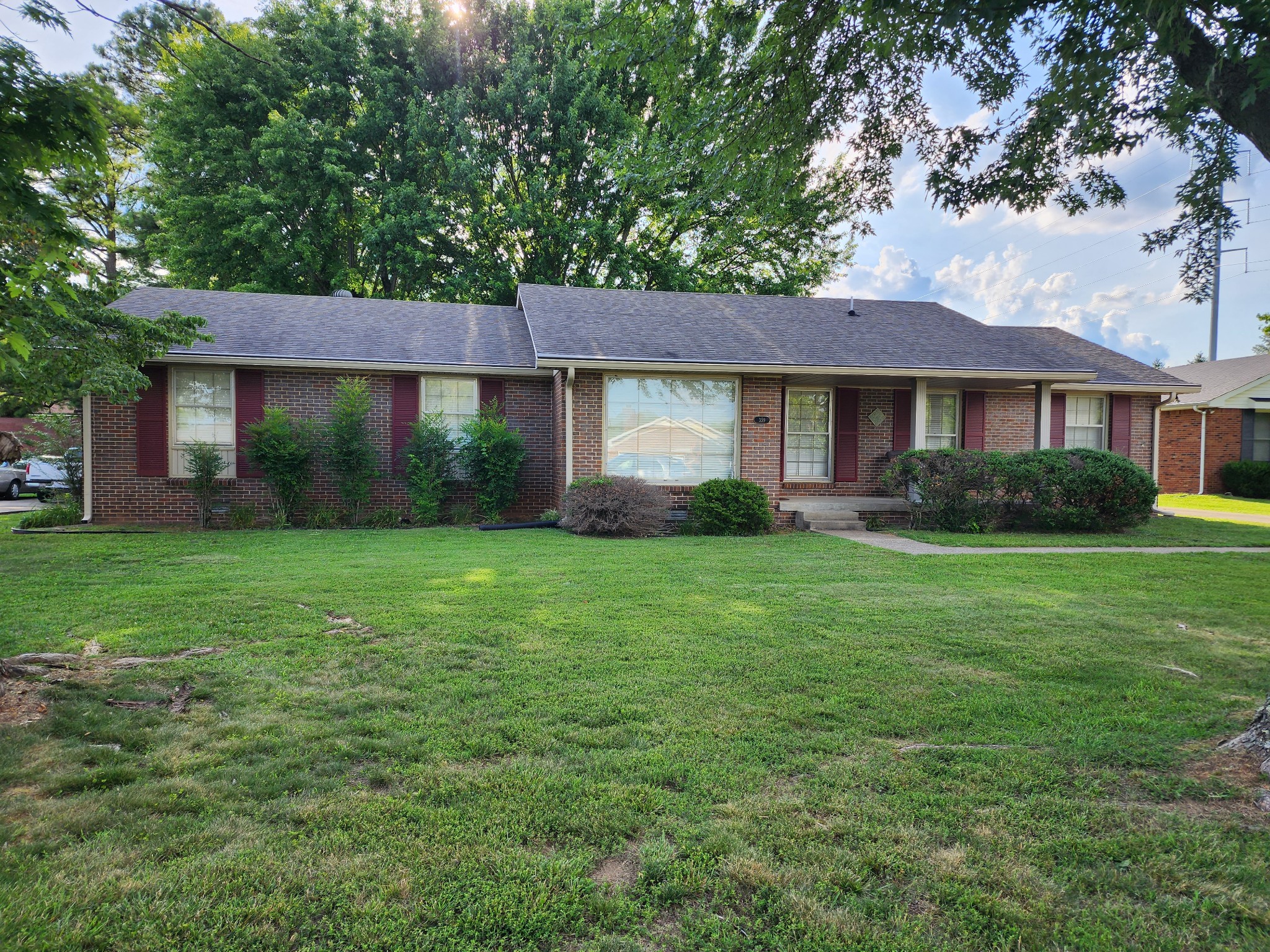 359 Kimbrough Road Clarksville, TN 37043 - Photo 1 of 6 a front view of a house with a garden and yard