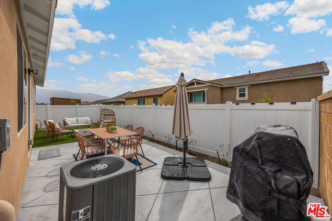 519 Tucker Avenue Rialto, CA 92377 - Photo 20 of 45 a roof deck with table and chairs