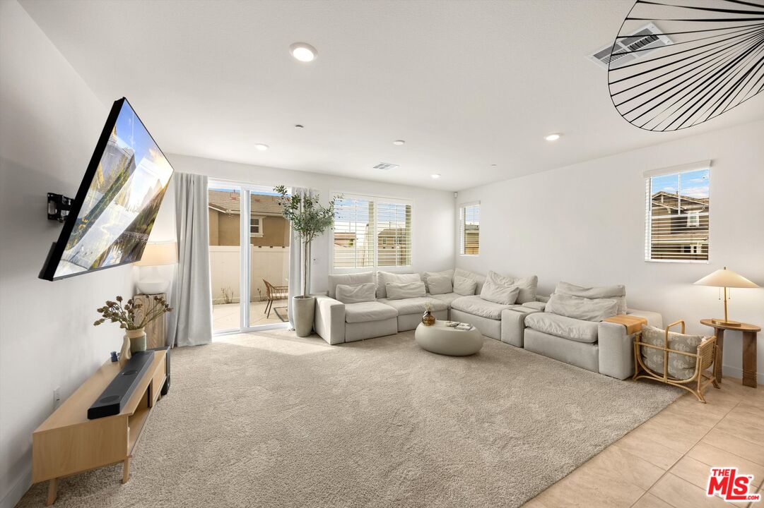 519 Tucker Avenue Rialto, CA 92377 - Photo 2 of 45 a living room with furniture and a large window