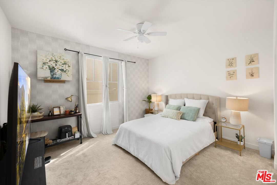 519 Tucker Avenue Rialto, CA 92377 - Photo 21 of 45 a bedroom with a bed and a large mirror