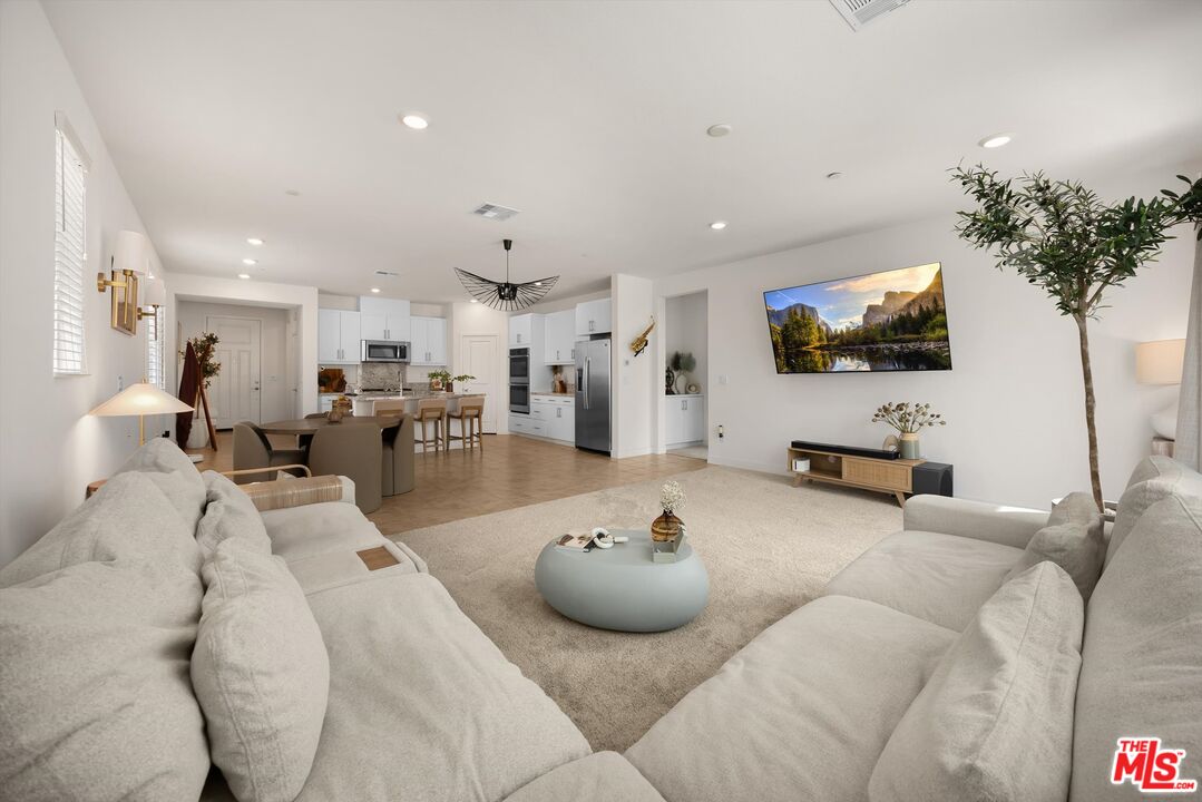519 Tucker Avenue Rialto, CA 92377 - Photo 3 of 45 a living room with furniture and a flat screen tv