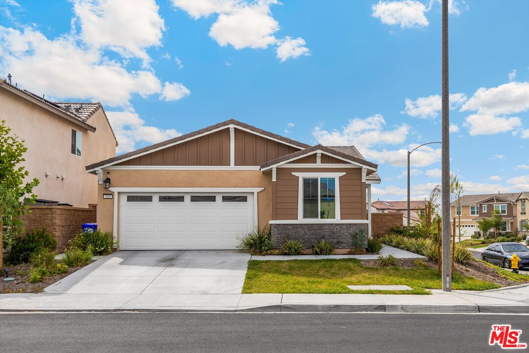 519 Tucker Avenue Rialto, CA 92377 - Photo 34 of 45 a front view of a house with yard