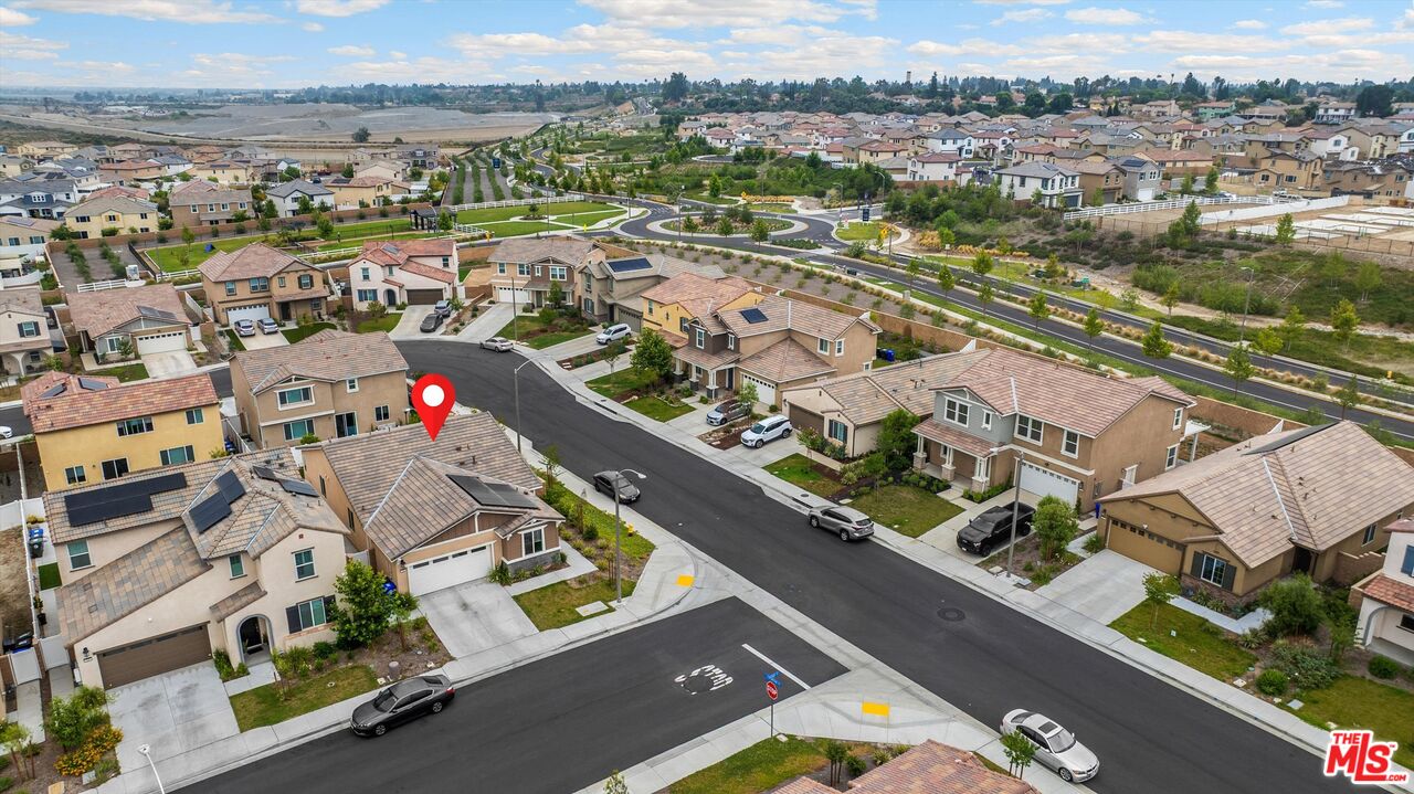 519 Tucker Avenue Rialto, CA 92377 - Photo 44 of 45 an aerial view of a city with streets and houses