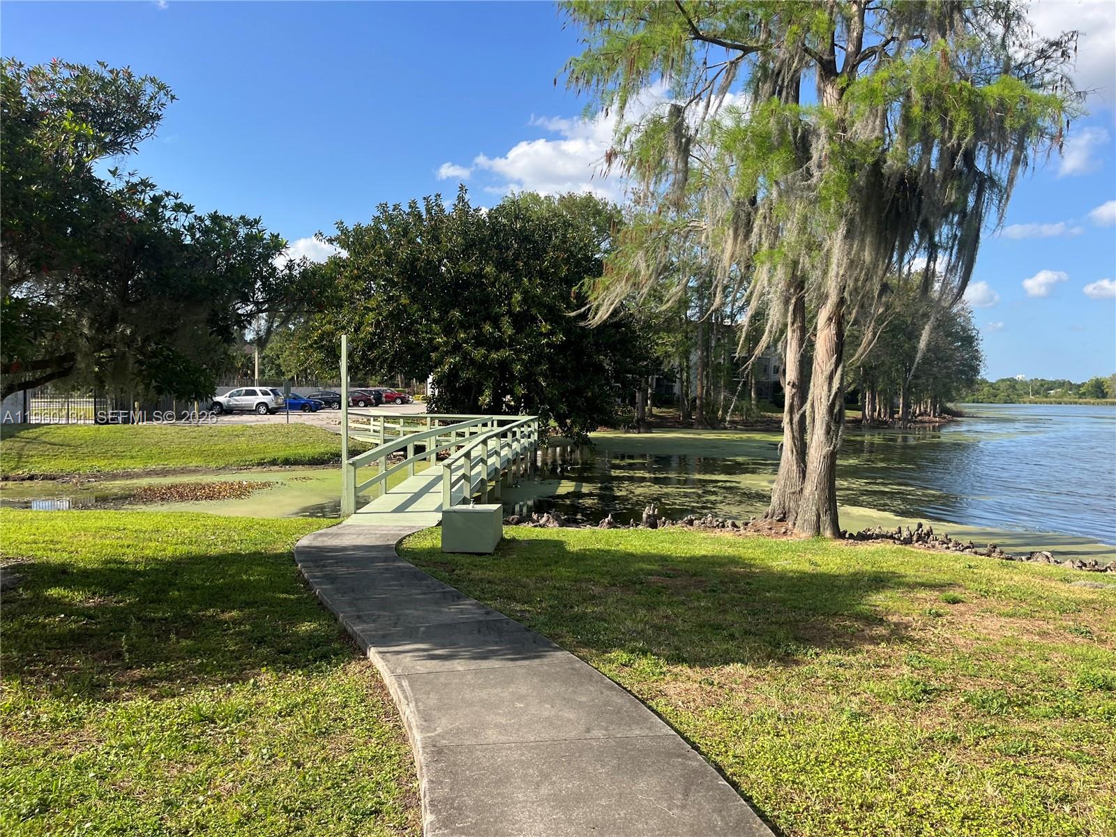 4575 South Texas Avenue, Unit 307 Orlando, FL 32839 - Photo 38 of 40 a view of a yard with swimming pool