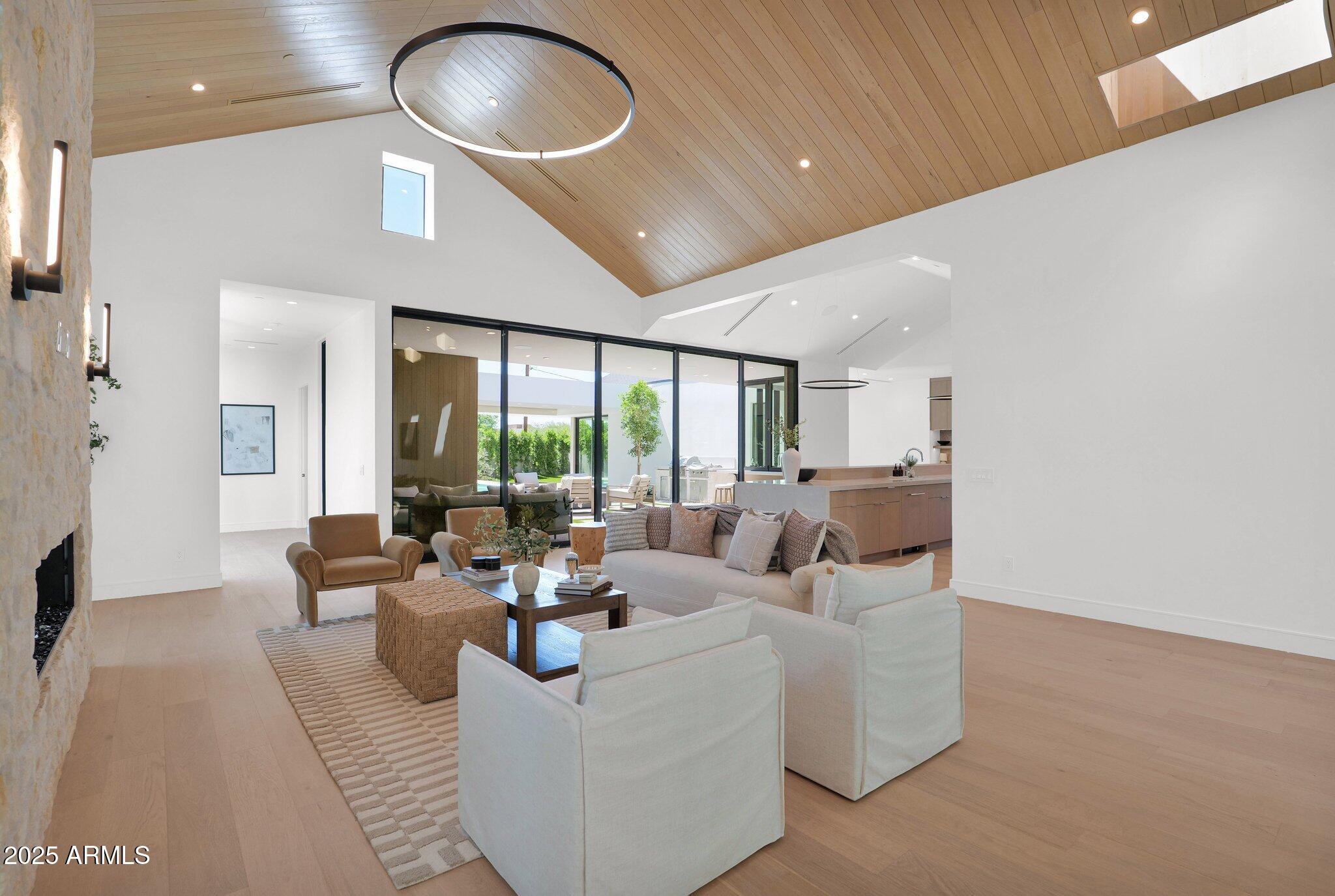4704 North 40th Place Phoenix, AZ 85018 - Photo 11 of 65 a living room with furniture and a large window
