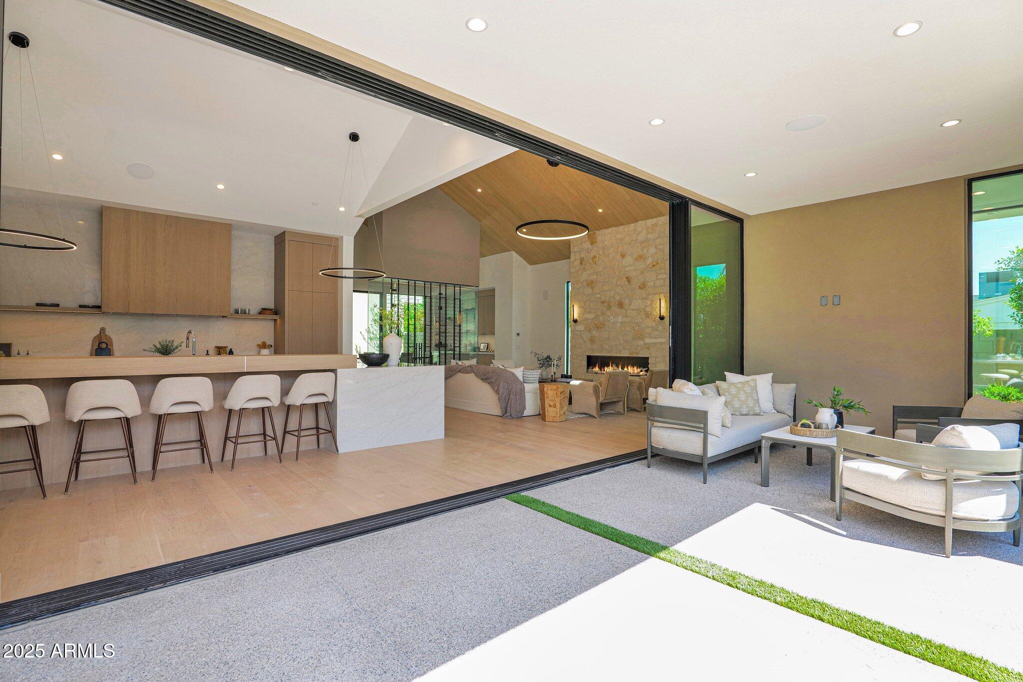 4704 North 40th Place Phoenix, AZ 85018 - Photo 18 of 65 a living room with furniture and a large window