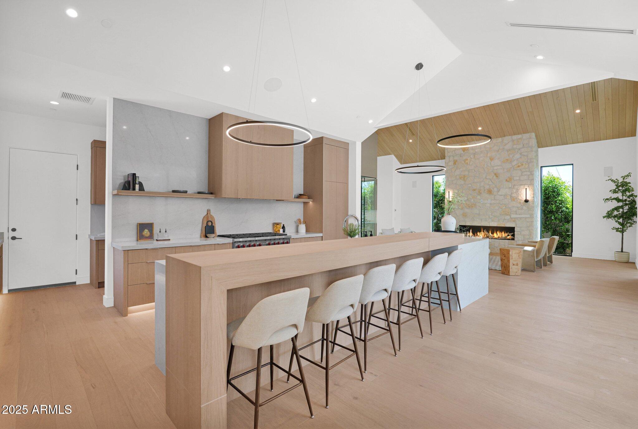 4704 North 40th Place Phoenix, AZ 85018 - Photo 19 of 65 a large kitchen with lots of counter space a sink and chairs