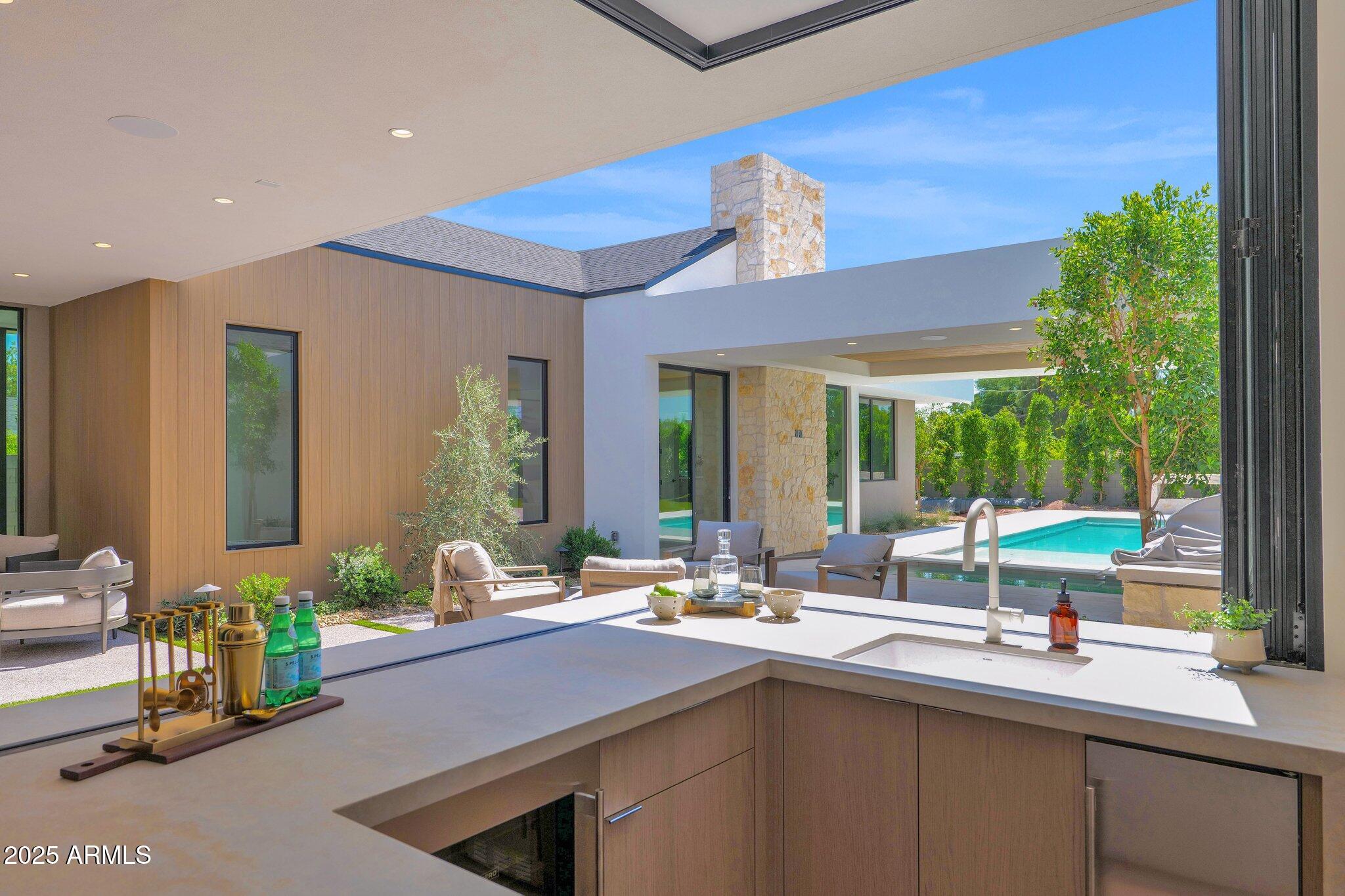 4704 North 40th Place Phoenix, AZ 85018 - Photo 29 of 65 a kitchen with a sink and a large window