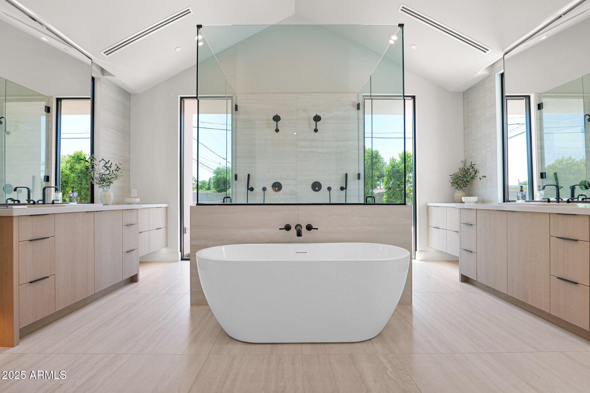 4704 North 40th Place Phoenix, AZ 85018 - Photo 37 of 65 a bathroom with a bathtub and a sink