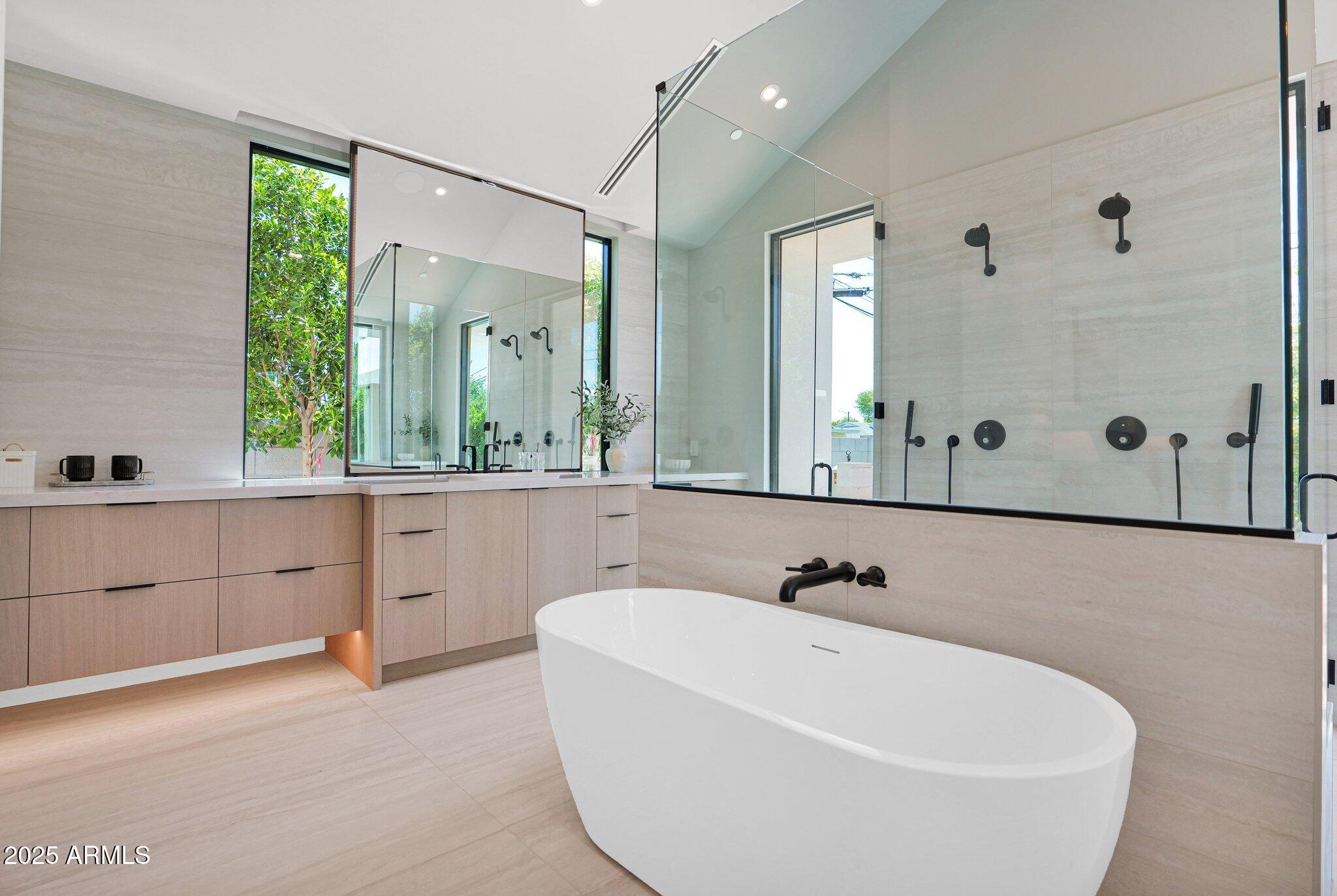 4704 North 40th Place Phoenix, AZ 85018 - Photo 38 of 65 a bathroom with a bathtub and a sink