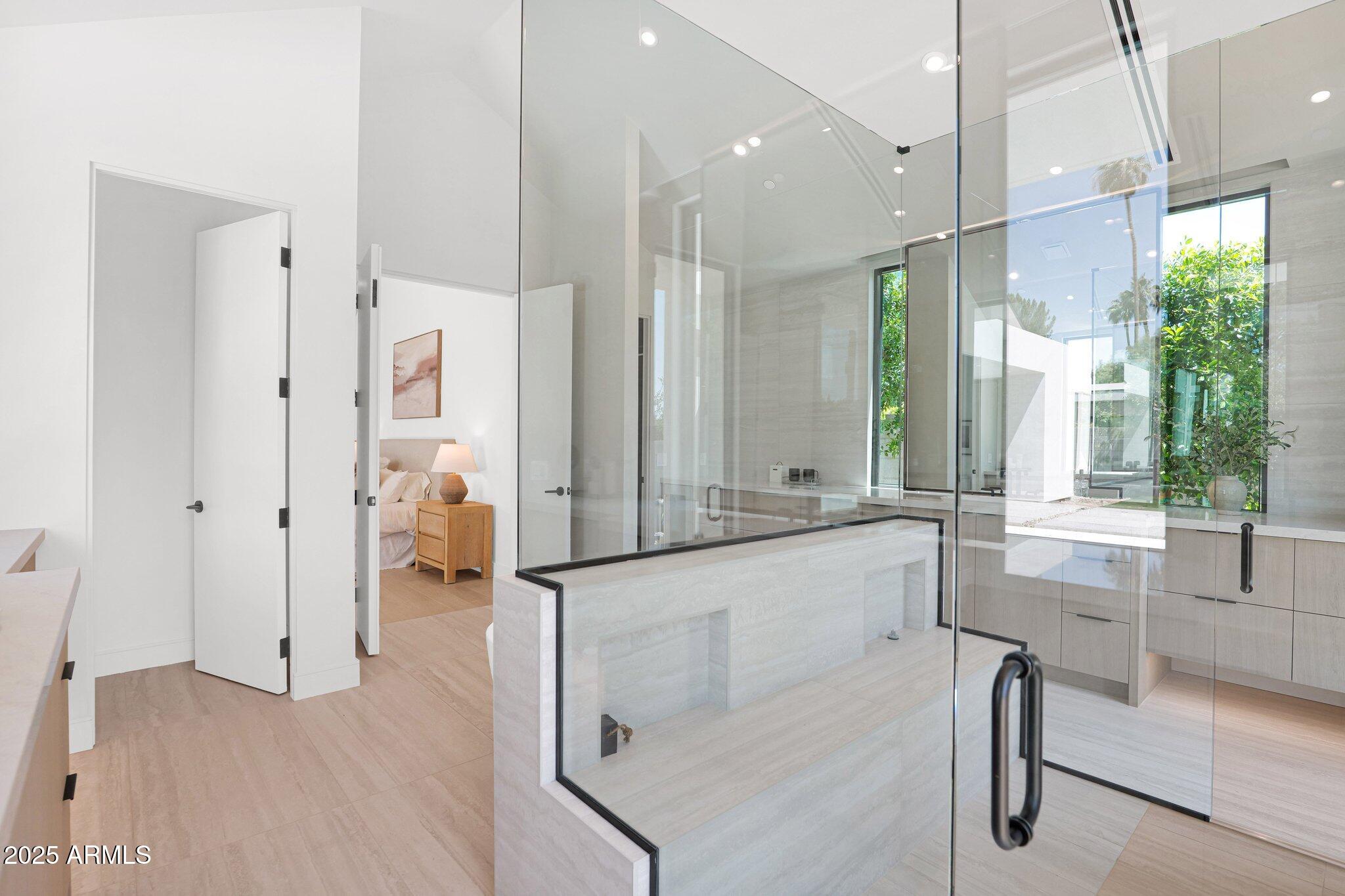 4704 North 40th Place Phoenix, AZ 85018 - Photo 40 of 65 a large bathroom with a large tub and shower