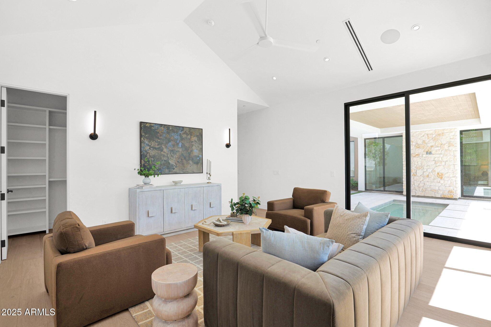 4704 North 40th Place Phoenix, AZ 85018 - Photo 46 of 65 a living room with furniture and a large window