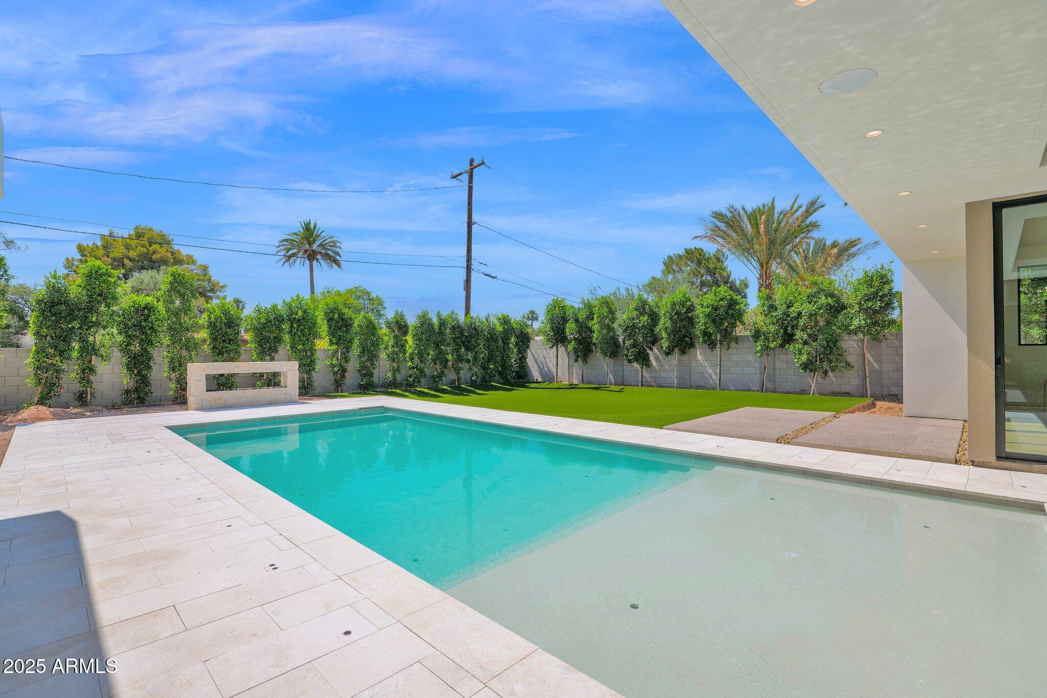 4704 North 40th Place Phoenix, AZ 85018 - Photo 52 of 65 a view of a swimming pool with a yard