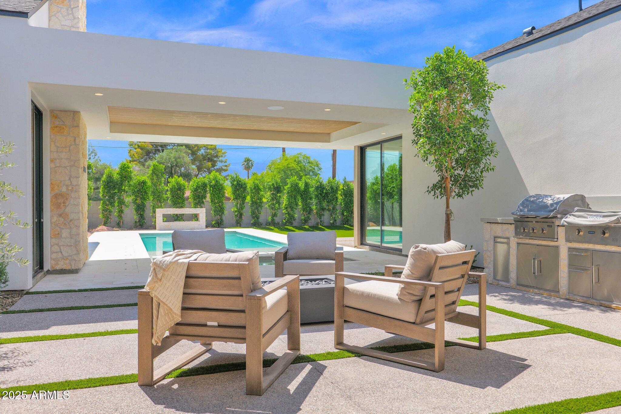 4704 North 40th Place Phoenix, AZ 85018 - Photo 56 of 65 a building outdoor space with patio furniture