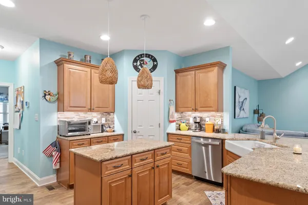 a stove top oven sitting inside of a kitchen