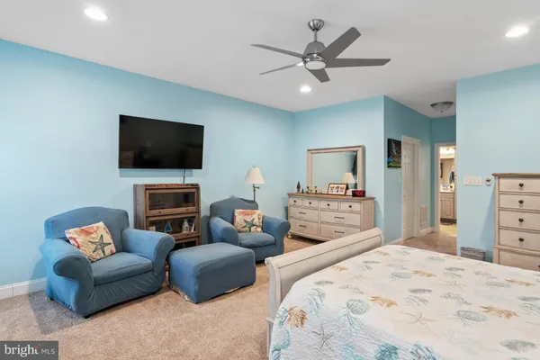 a view of a livingroom with workspace and a couch