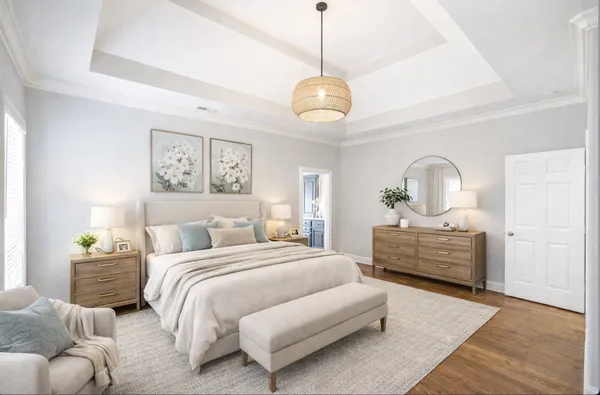 a bedroom with bed and wooden floor